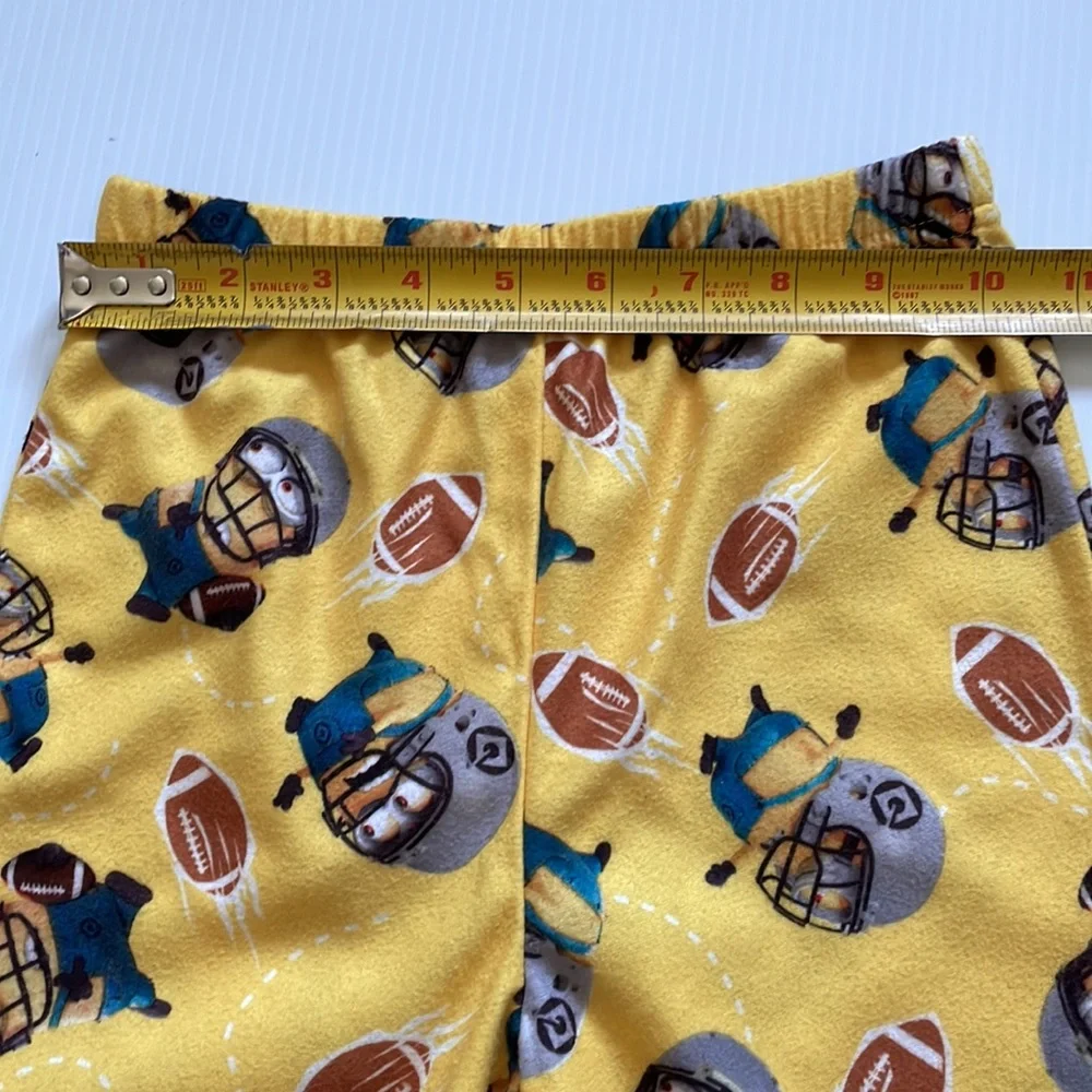 Minions yellow football pajama top & bottoms.  Size 4